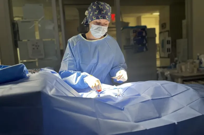 Medical staff performing surgery