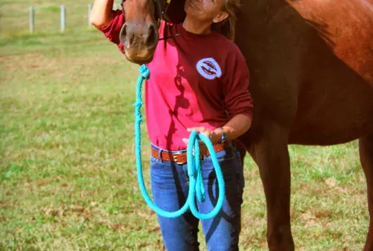 Woman outdoors with horse