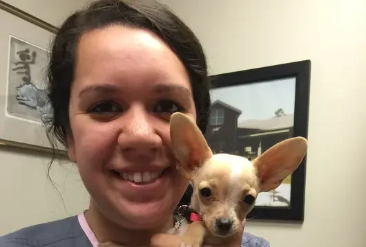 Christina Ellwood with a small dog