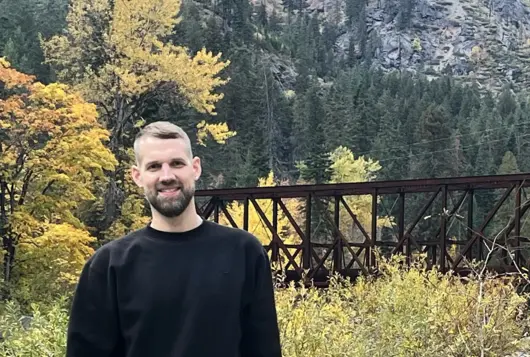 photo of James Pumphrey with forest in the background 