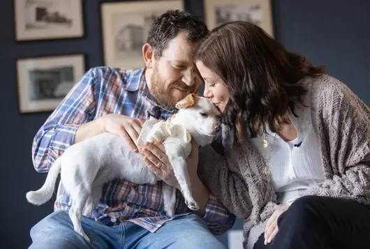 Photo of couple with small dog