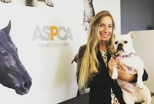 audrey tamez with a white bulldog in her arms