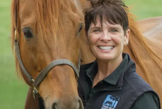 nancy turner with a golden brown horse