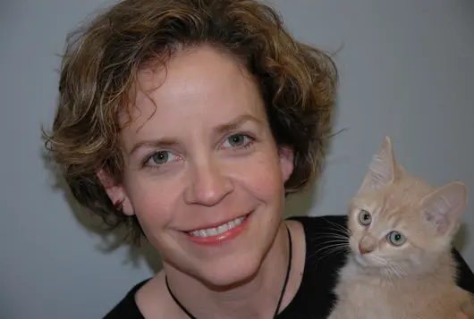 sarah hess and an orange kitten