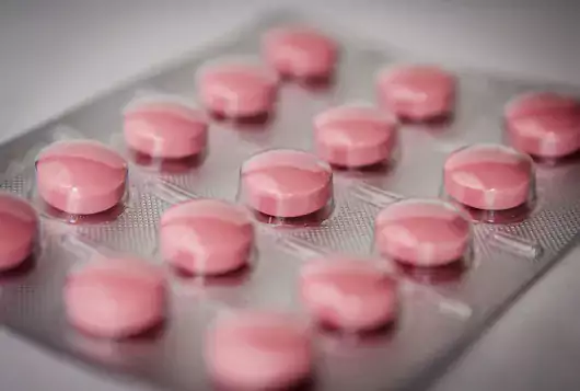 blister pack of several pink pills