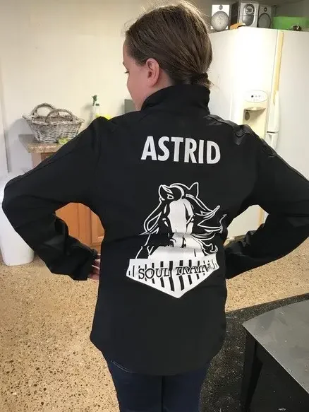 girl wears a soul train jacket