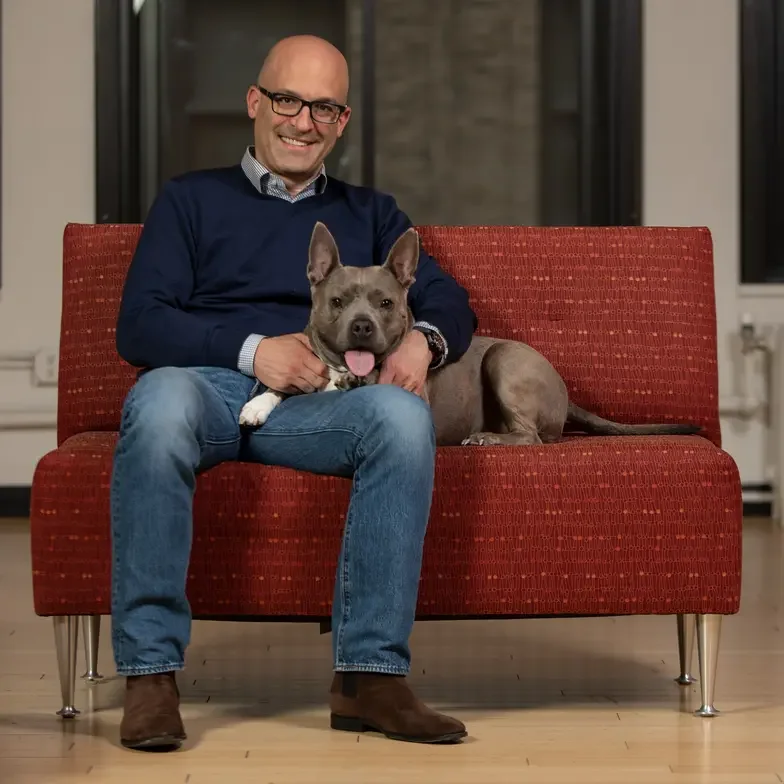 matt bershadker with happy grey dog