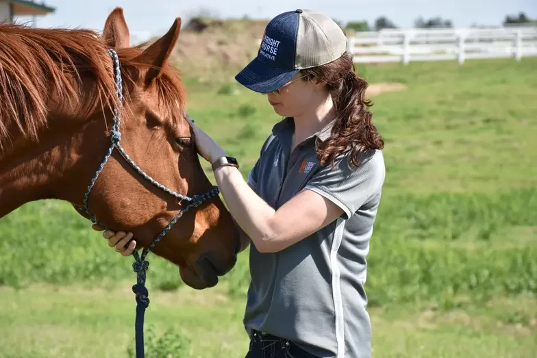 woman with a brown horse
