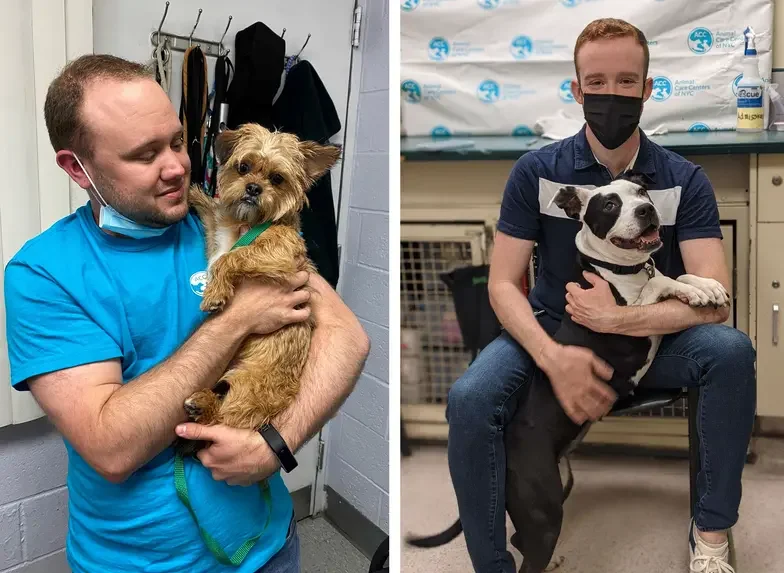 one man holding a small dog and another man supporting a larger dog