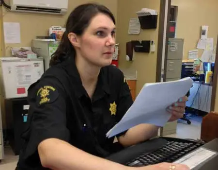 police officer at computer